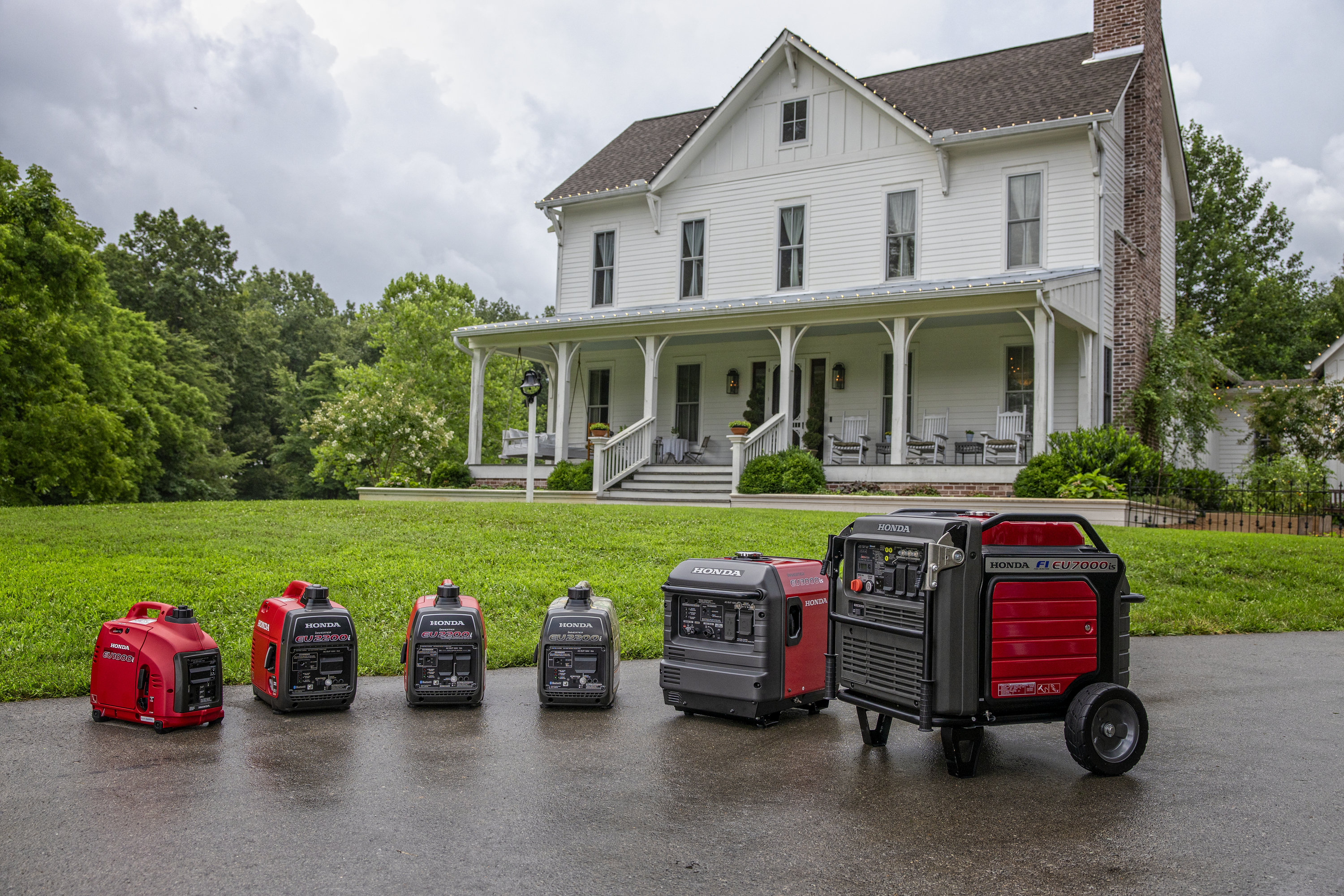 Honda generator family in front of home and storm to protect from power outage